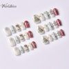 Christmas press on nails set with red and white snowflake design